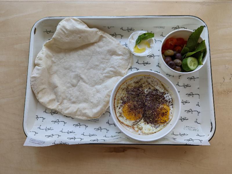 Manousheh: Lebanese Breakfast Sujuk on thd side 
Less oil, 1 x $13.00
Two eggs, seasoned with sumac and zaatar, and served with a side of veggies, labneh and a flatbread.