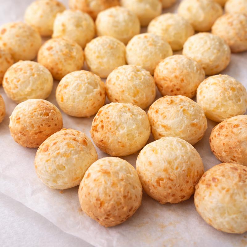 Brigadeiro Bakery: Pão de Queijo - freshly baked Brazilian cheese rolls , 1 x $3.95
Baked fresh every hour at Brigadeiro Bakery, our traditional Pão de Queijo is naturally gluten-free and made using authentic Brazilian ingredients. Each roll weighs 80g and has the perfect balance of a crispy golden exterior and a soft, cheesy center.

Available individually, by the half dozen, or by the dozen—perfect whether you're grabbing a quick snack or sharing with friends and family.

Ingredients: Parmesan, Mozzarella, Eggs, Milk, Salt, Tapioca Starch and Vegetable Oil.