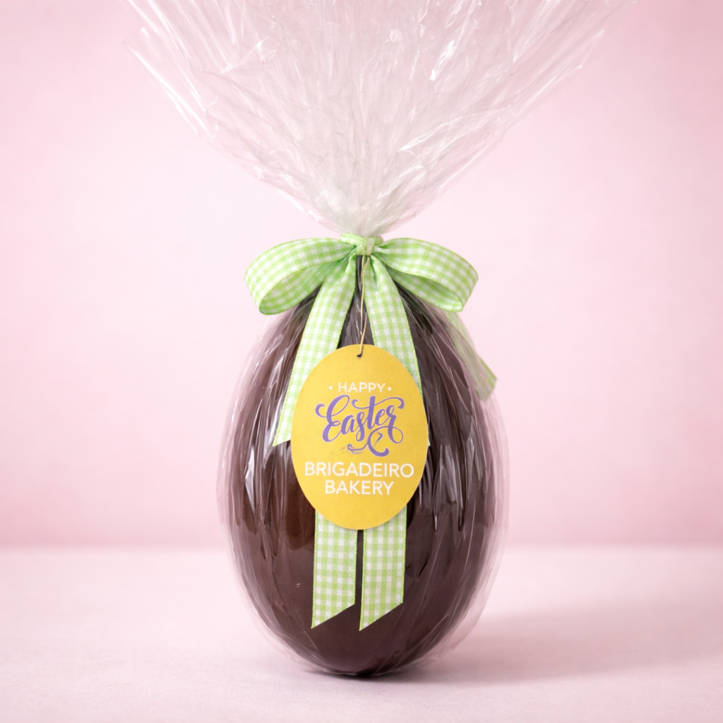 Brigadeiro Bakery: Pistachio Dark Easter Egg, 1 x $80.00
Crafted for true chocolate lovers, this handmade Easter egg features a shell of fine dark chocolate, filled generously with our signature pistachio brigadeiro—silky, creamy, and irresistibly nutty.
Each spoonful delivers the perfect balance of deep chocolate richness and delicate pistachio flavor, creating a luxurious experience from the very first bite.
Designed to be shared… but once you crack it open, you may want to keep it all to yourself.
A beautiful gift for family, friends, or a well-deserved treat just for you—because Easter should feel this indulgent.
Weight: approx. 1.1 lb / 500 g Handmade in small batches
Shelf Life: Up to 14 days refrigerated
Important Delivery Info: To ensure your Easter egg arrives fresh and in perfect condition, please include the name and phone number of the person available to receive the delivery. This allows our team to coordinate smoothly—so your chocolate stays exactly as it should: flawless, not melted.