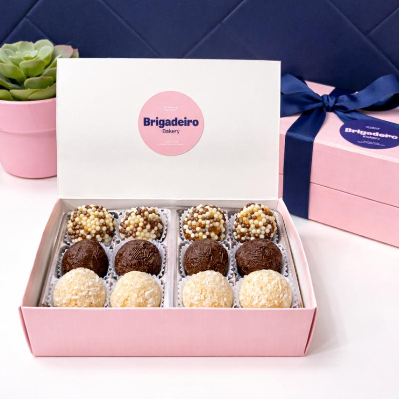 Brigadeiro Bakery: Gift box with 12 Brigadeiros, 1 x $35.00
Our Gift Box with 12 Brigadeiros is the perfect way to share a little taste of Brazil. Brigadeiros are Brazil’s beloved chocolate truffles, made with sweetened condensed milk and chocolate, slowly cooked to create a rich, creamy center and finished with delicious toppings.
With this box, you can choose up to 4 different flavors, creating a personalized assortment of your favorites.
Each brigadeiro is handcrafted and made to order in small batches using traditional Brazilian techniques and high-quality ingredients. Our artisan process ensures every piece has the perfect creamy texture and rich flavor.
Beautifully packaged and ready for gifting, this box is perfect for celebrations, thank-you gifts, or simply treating yourself to something special.