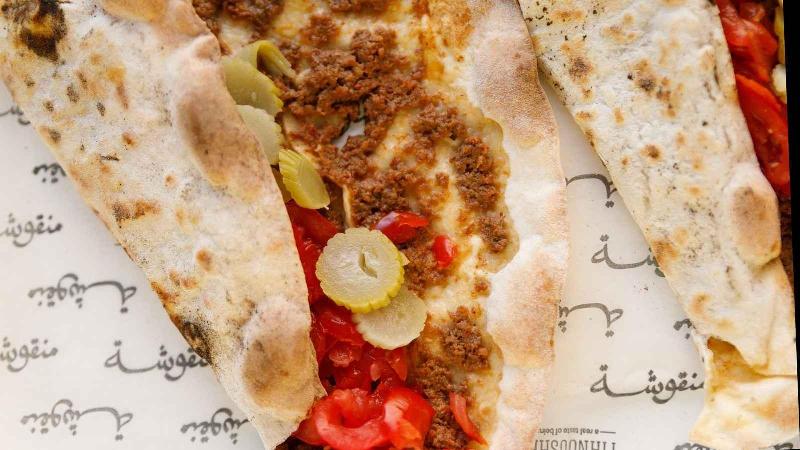 Manousheh: Sujuk Bi Ajine - TP , 1 x $9.00
Middle eastern beef sausage prepared with red wine, garlic, tomato, and onion baked on our crispy flatbread