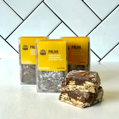 Brigadeiro Bakery: Palha , 1 x $5.50
Layers of Chocolate Brigadeiro in between Maria Cookies. Brazilians know best, Palha is the only snack bar you’ll need.

Palha Single
Palha Trio

Ingredients

Milk, sugar, cocoa powder, butter, confectioners sugar, maria cookies (wheat flour, sugar, glucose syrup, vegetable oils, salt, sodium and ammonium bicarbonates, lecithin, sodium metabisulphite, coloring E150d 

Shelf life: 14 days refrigerated