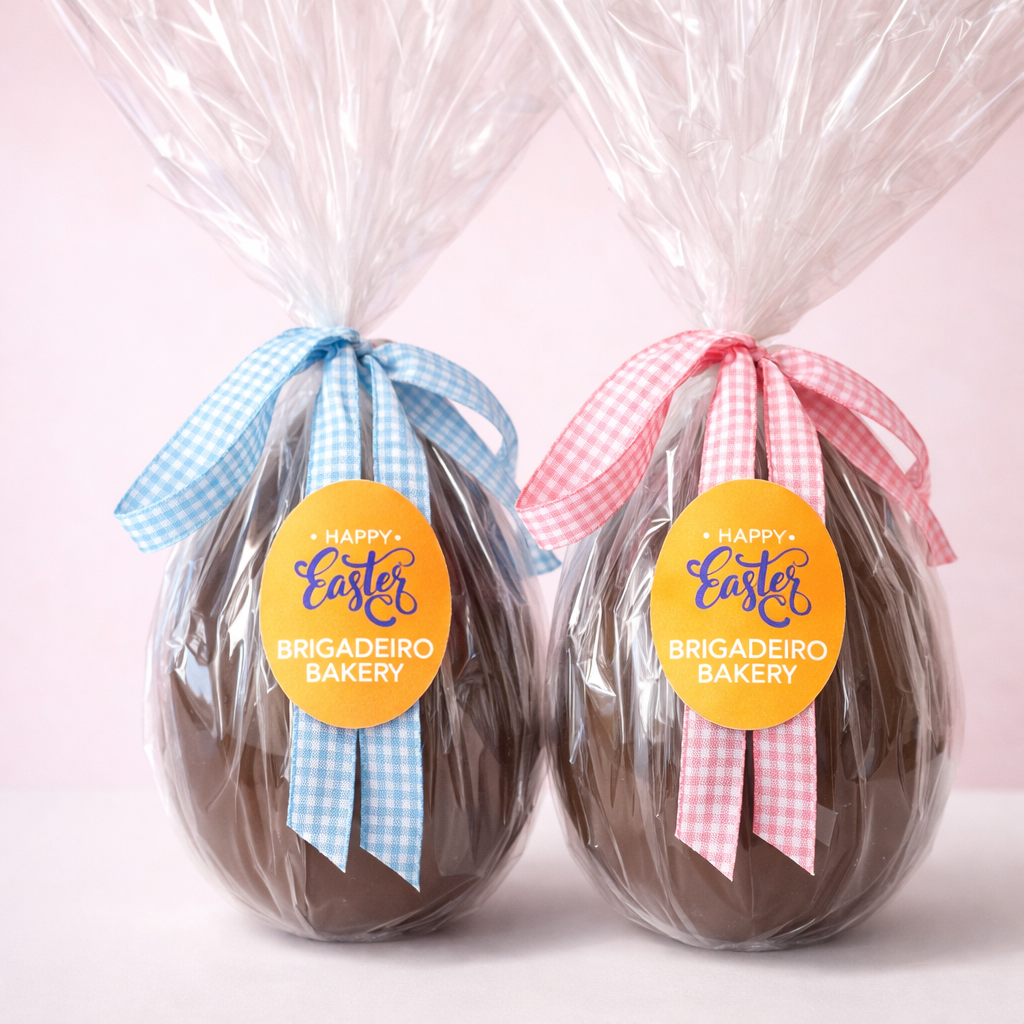 Brigadeiro Bakery: Big Joys - Milk Chocolate Egg with 6 Easter Brigadeiros, 2 x $52.00
A handmade milk chocolate Easter egg filled with 6 delightful Easter brigadeiros inside! 
Each bite is a creamy, chocolatey treat, making this egg perfect for little ones - or big ones who love a fun surprise!

A perfect gift for kids, family, or anyone who enjoys a sweet, festive treat this Easter!

Weight: approx. 0.88lbs / 400 g

Handmade.

Shelf life:
14 days refrigerated.

Important Delivery Info:
We want your treats to arrive fresh, safe, and right on time! To make that happen, please provide a contact name and phone number for the person who will be available during the delivery window. This helps our team coordinate and ensures your order gets to the right hands—no melted chocolate or missed deliveries here!