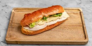 Aux Merveilleux de Fred - Midtown: Turkey & Swiss Brioche Sandwich, 1 x $8.50
Our signature Brioche bun filled with finely sliced Turkey and Swiss cheese, and complemented with salad and a mayo mustard mix. A moist, soft and balanced sandwich where bread is a star!