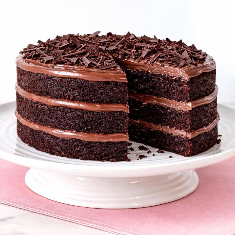 Brigadeiro Bakery: *Gluten-Free* Brazilian Chocolate Cake, 1 x $95.00
Gluten-Free Chocolate Brigadeiro Cake
Indulge in the ultimate chocolate celebration. Our gluten-free chocolate Brigadeiro cake is deeply rich, incredibly moist, and layered to perfection. Each tier is filled and finished with our signature creamy chocolate Brigadeiro frosting, then crowned with elegant dark chocolate shavings for an extra touch of decadence.
A true dream cake for chocolate lovers — bold, luscious, and unmistakably Brazilian.
Cake Sizes & Servings
7” Three-Layer Cake — serves approximately 12–15 slices
9” Three-Layer Cake — serves approximately 20–25 slices
12” Three-Layer Cake — serves approximately 40–50 slices
Important Dietary Note
Made with gluten-free ingredients; however, it is prepared in a facility that handles gluten.
 Not suitable for individuals with Celiac disease — recommended for those following a gluten-restricted diet.
Shelf Life
Keeps fresh for up to 7 days when refrigerated.
Local Delivery
We partner with Uber Package for local deliveries.
 Please provide a contact person to receive the cake, or let us know if there is a doorman available.