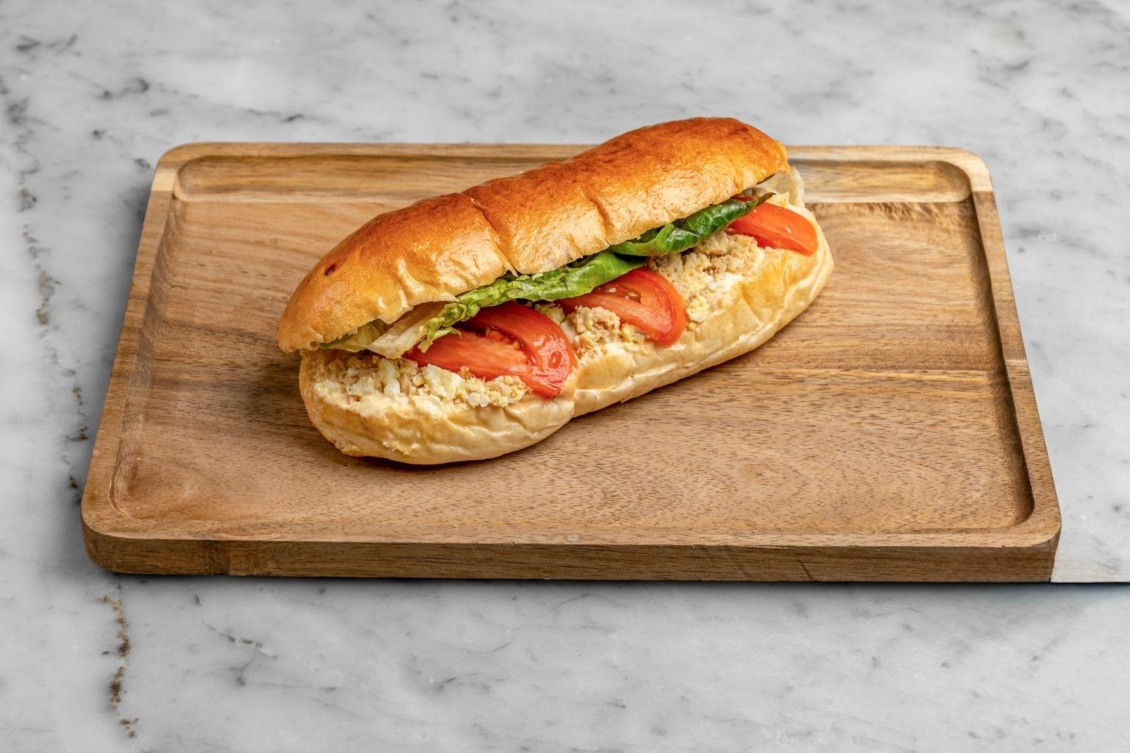Aux Merveilleux de Fred - West Village: Tuna Brioche Sandwich, 1 x $8.80
Our signature Brioche bun filled with Tuna, Boiled eggs, Fresh tomatoes, and complemented with salad and mayo mustard mix. A moist, soft and balanced sandwich where bread is a star!