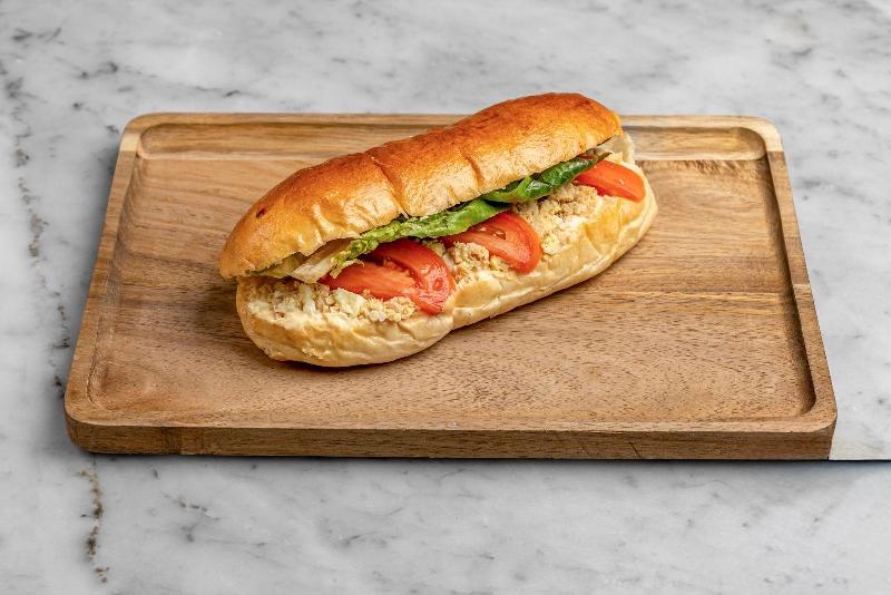 Aux Merveilleux de Fred - West Village: Tuna Brioche Sandwich, 1 x $8.80
Our signature Brioche bun filled with Tuna, Boiled eggs, Fresh tomatoes, and complemented with salad and mayo mustard mix. A moist, soft and balanced sandwich where bread is a star!