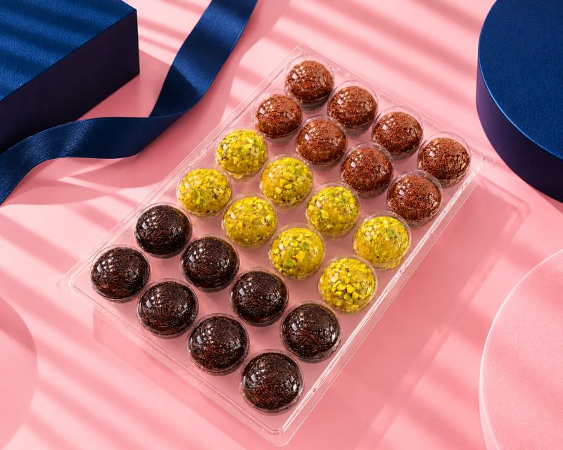Brigadeiro Bakery: Shippable 24 Brigadeiros, 1 x $65.00
Brigadeiro is a delicious and popular Brazilian sweet treat, often referred to as a type of bonbon or truffle. It is one of the most beloved desserts in Brazil and is commonly served at parties, celebrations, and gatherings. The brigadeiro's simplicity and rich flavor make it a favorite among people of all ages.
Our Best Sellers Brigadeiros - soft truffles -
