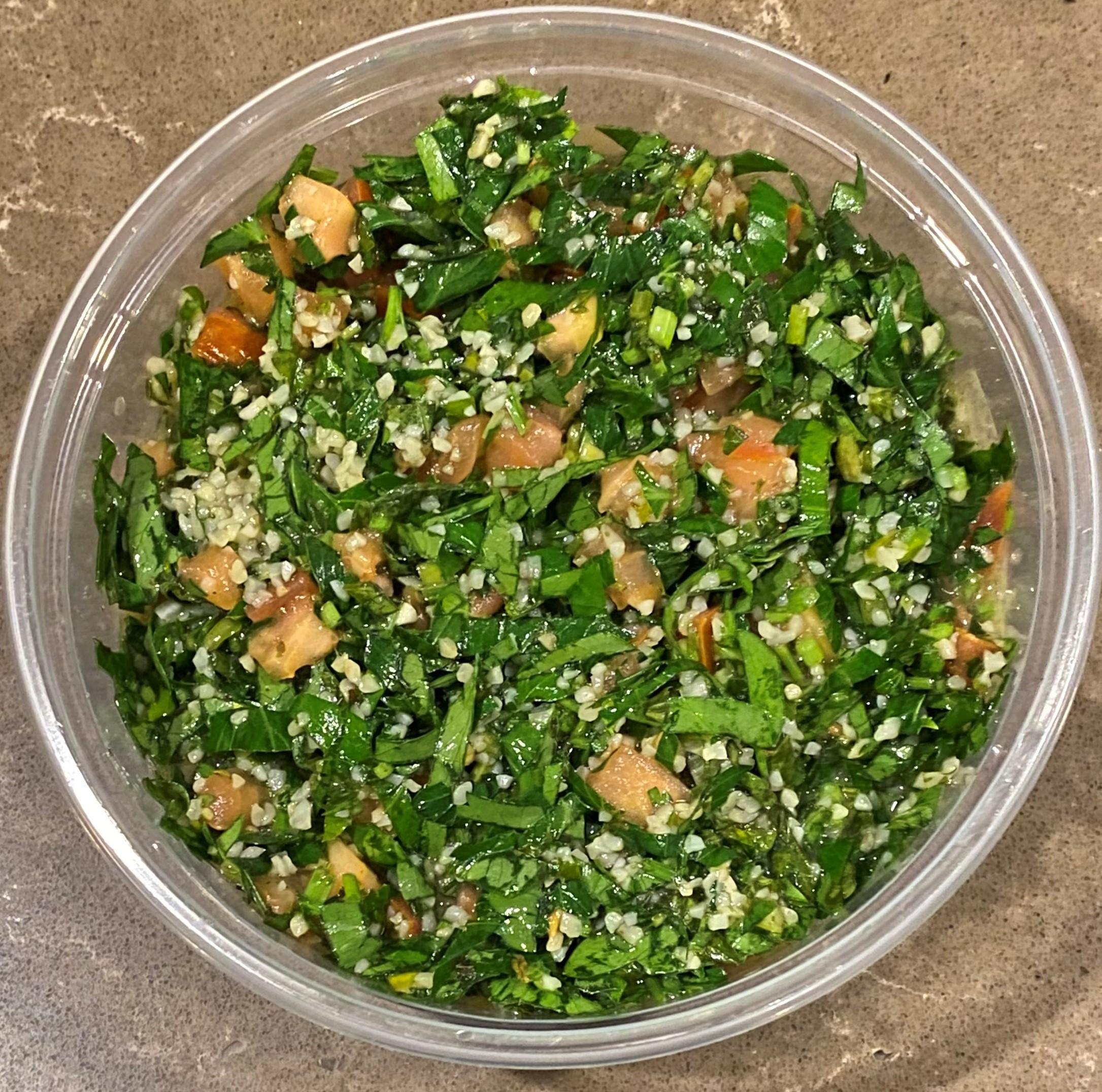 Casba Food And Pastries: Tabbouleh, 1 x $8.00
Chopped parsley, with tomatoes, mint, onion, bulgur, olive oils, and seasonings. Served with a side of pita bread.