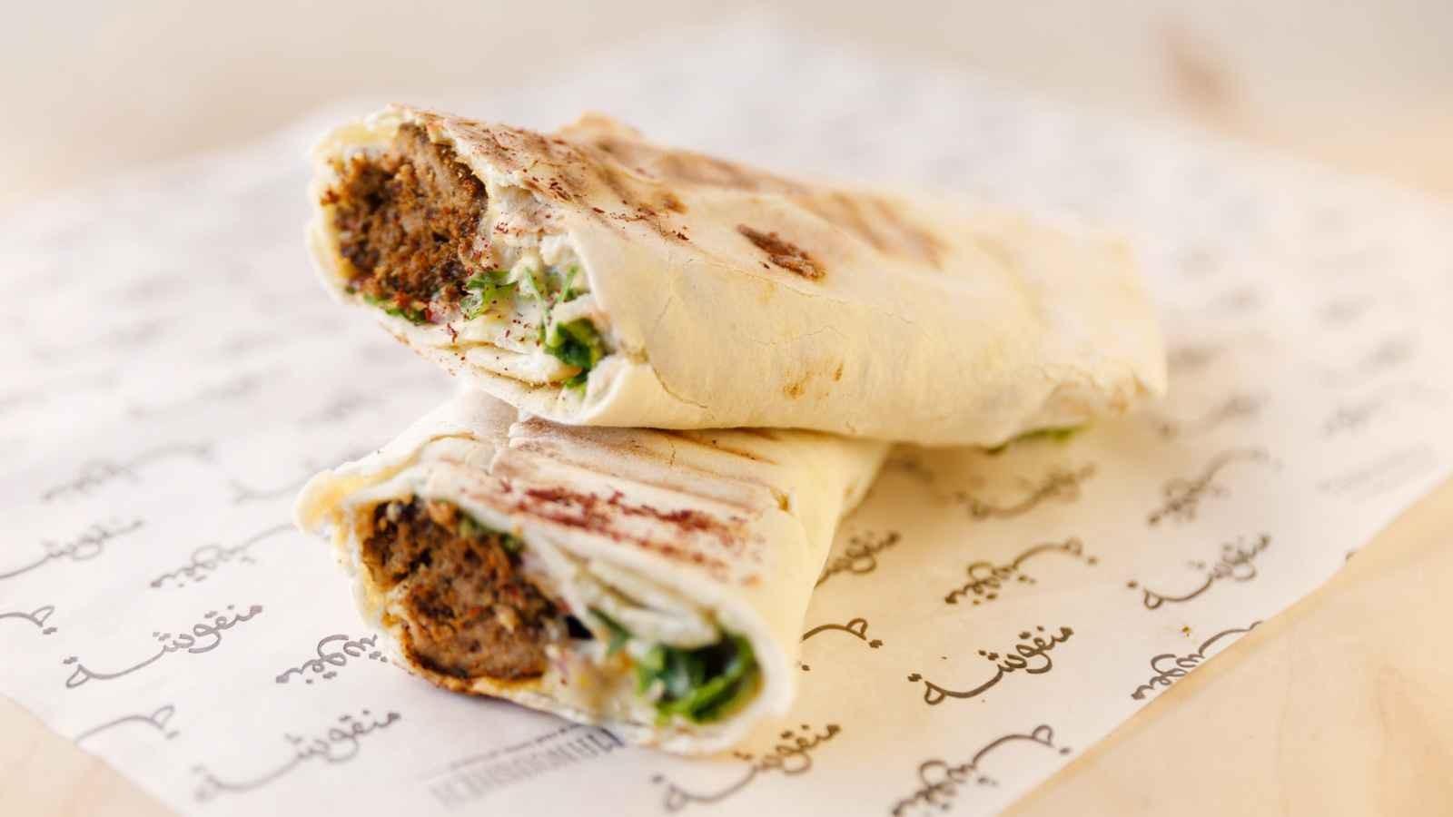 Manousheh: Kafta - TP , 1 x $14.00
Ground lamb and beef served with hummus, onion, and parsley sumac mix on our freshly baked flatbread