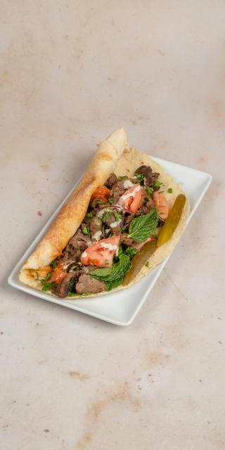 SALMA EAST VILLAGE: Lamb Shawarma Sandwich, 1 x $14.50
Beef, gluten. Thinly sliced cuts of your choice of lamb