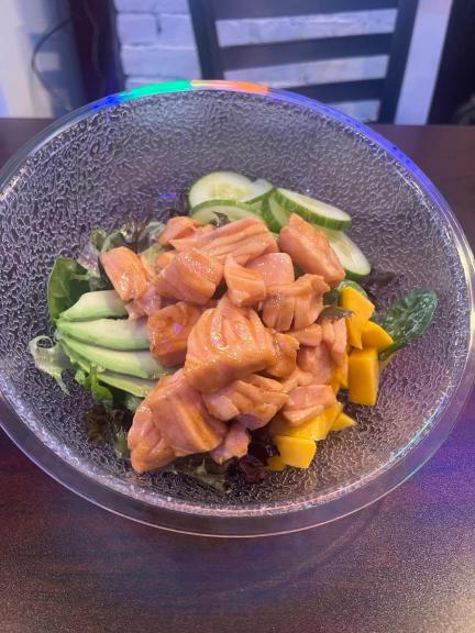 Lobstah On A Roll: Marinated Salmon Poke Bowl, 1 x $18.90
Fresh salmon poke bowl paired with creamy avocado, crisp cucumber, juicy mango, and spring onions, served on a bed of mixed greens and sushi rice, garnished with a sesame vinaigrette.