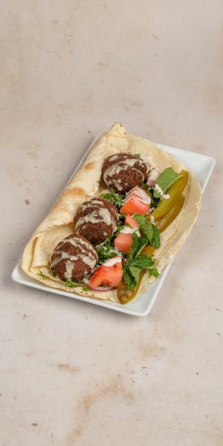 SALMA EAST VILLAGE: Falafel Sandwich, 1 x $12.50
Gluten. Deep-fried ball or patty-shaped fritter made from ground chickpeas and fava beans, served with our special tahini sauce