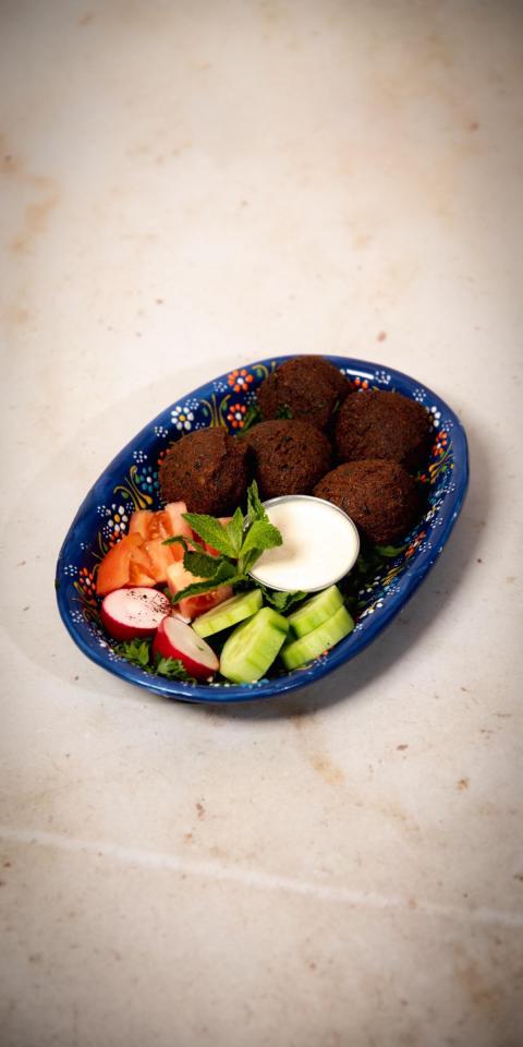 SALMA EAST VILLAGE: Falafel Platter, 1 x $15.50
Deep-fried ball or patty-shaped fritter made from ground chickpeas and fava beans, served with our special Tahini sauce