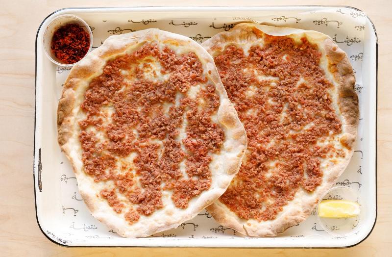 Manousheh: Combo bi ajine IN STORE Cut in four, 1 x $13.00
2 for $12 special on lahem bi ajine and sujuk bi ajine.  Get two lahmeh, two sujuk, or one of each.
