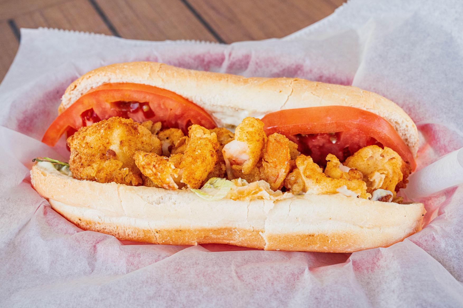 Lobstah On A Roll: The Shrimp Boat Po' Boy No onion, 1 x $17.90
Indulge in the mouthwatering delight of The Shrimp Boat Poboy, featuring crispy fried shrimp, fresh lettuce, juicy tomato, savory onion, and zesty tartar sauce all nestled in a perfectly grilled roll. Elevate your lunch game with this sensational seafood sensation - order now!