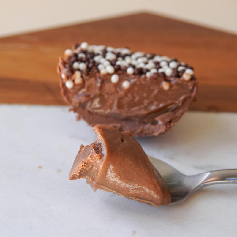 Brigadeiro Bakery: Spoonable Chocolate Brigadeiro Easter Egg, 1 x $14.50
A smooth milk chocolate half shell filled with rich, creamy Brigadeiro—Brazil’s favorite chocolate treat. Made fresh in small batches, this spoonable egg is perfect for Easter gifting or enjoying straight from the shell.

A perfect little treat for family, friends, or yourself—because sometimes, the best treats come in small, spoonable packages!

Ingredients
38% milk chocolate, milk, sugar, butter, cocoa powder, 58% dark chocolate, corn starch and chocolate sprinkles.

Weight: approx. 0.37lbs / 170g

Shelf life
14 days refrigerated

Handmade.

Shelf life:
14 days refrigerated.

Important Delivery Info:
We want your treats to arrive fresh, safe, and right on time! To make that happen, please provide a contact name and phone number for the person who will be available during the delivery window. This helps our team coordinate and ensures your order gets to the right hands—no melted chocolate or missed deliveries here!