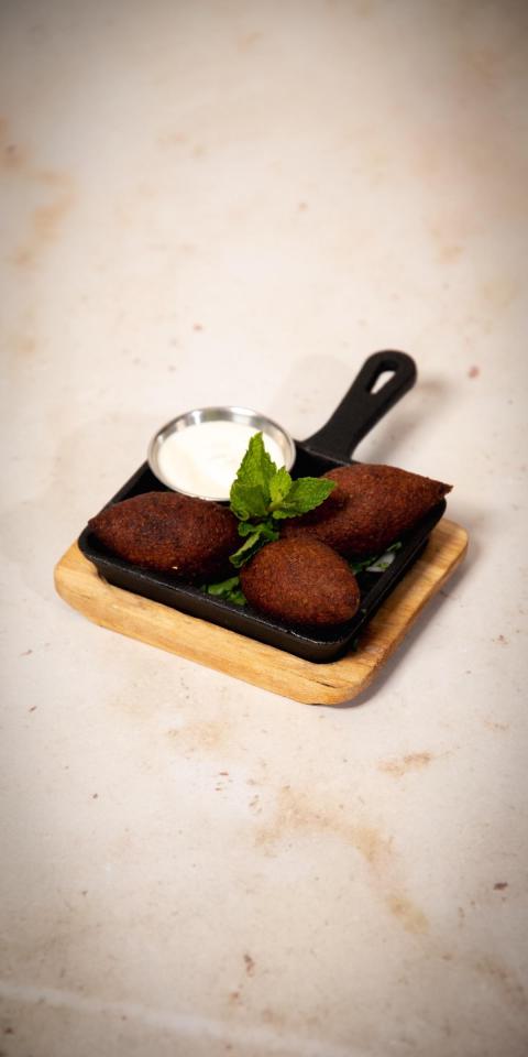 SALMA EAST VILLAGE: Kebbeh, 1 x $12.50
Beef, gluten. 3 meat and bulgur shells stuffed with a meat filling