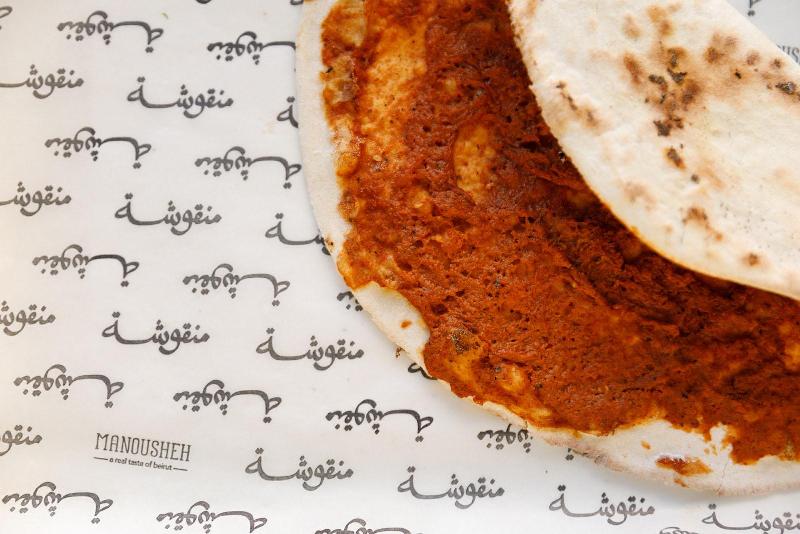 Manousheh: Muhammara Manousheh, 1 x $12.00
roasted red pepper dip with garlic, walnut, and pomegranate molasses spread on our freshly baked flatbread