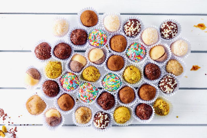 Brigadeiro Bakery: Best Sellers Brigadeiro Box, 1 x $36.00
Brigadeiro is a delicious and popular Brazilian sweet treat, often referred to as a type of bonbon or truffle. It is one of the most beloved desserts in Brazil and is commonly served at parties, celebrations, and gatherings. The brigadeiro's simplicity and rich flavor make it a favorite among people of all ages.
Our Best Sellers Brigadeiros (soft truffles):

Classic Chocolate – Rich chocolate is blended into sweetened condensed milk
to form this classic brigadeiro flavor. It is then rolled in chocolate sprinkles as
they traditionally do in Brazil.

Ingredients: Sweetened condensed milk, Nescau (chocolate powder), butter,
chocolate sprinkles, canola oil spray.

White Crunch – This sweet, gooey treat is rolled in chocolate crispies that add
the perfect crunch to its creamy interior.

Ingredients: sweetened condensed milk, butter, power ball, corn scratch, canola oil spray, crunch sprinkles.

Coconut – Coconut, which grows in abundance in Brazil, is the highlight of this
brigadeiro. Fresh coconut is infused with the creamy condensed milk ball and
then it is rolled in shredded coconut to make this classic flavor.

Ingredients: sweetened condensed milk, coconut (dried), butter, corn scratch,
canola oil spray

Two lovers – This brigadeiro features two classic flavors intertwined as one.
Rolled together in sugar, one side features the classic creamy condensed milk
flavor and the other is the creamy chocolate.

Ingredients: sweetened condensed milk, butter, power ball, corn scratch, coconut, Nescau (chocolate powder),