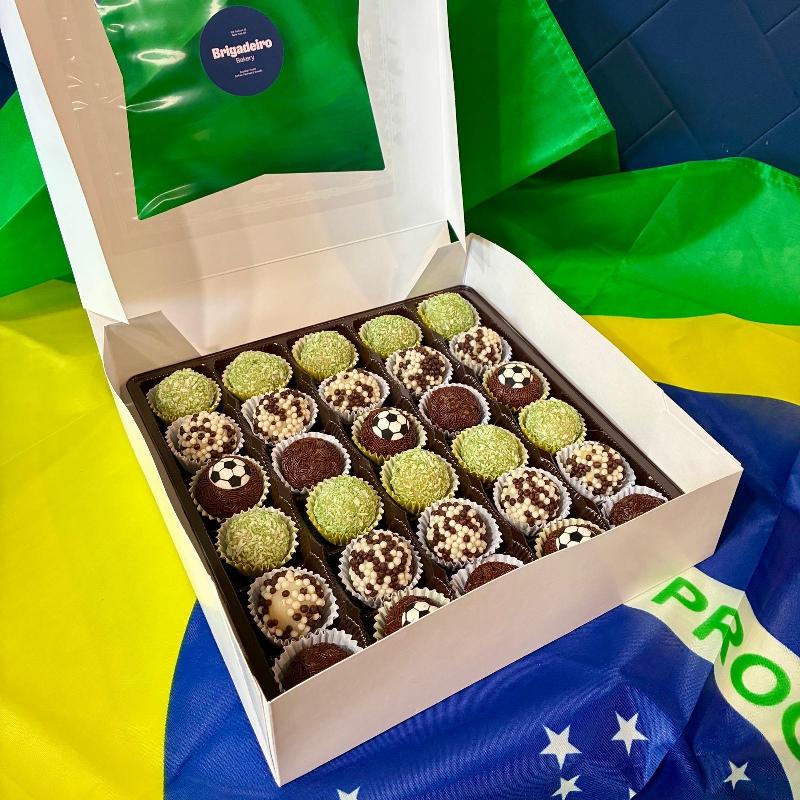 Brigadeiro Bakery: World Cup 2026 - 30 brigadeiros special box, 1 x $68.00
World Cup Edition Brigadeiro Box – 30 pieces 🇧🇷⚽
Celebrate the World Cup the Brazilian way! Our specialty brigadeiros are hand-decorated with a soccer-ball design, bringing all the energy and excitement of the beautiful game to your table.
This box includes 30 handcrafted brigadeiros in three fan-favorite flavors:
Chocolate – our classic, rich and creamy original
Coconut – smooth and fragrant, topped with toasted coconut
White Crunch – creamy white chocolate with a crispy bite
Perfect for watch parties, celebrations, or treating yourself during the tournament — these little soccer balls are almost too cute to eat (almost).
Pick-up and delivery available in New York City.