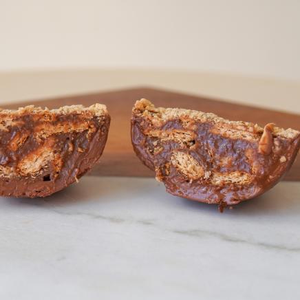 Brigadeiro Bakery: Spoonable Brigadeiro Palha Easter Egg, 2 x $29.00
A half shell of pure milk chocolate filled with creamy brigadeiro and chunks of crunchy Palha (Maria cookie). 
This spoonable treat is the perfect mix of smooth chocolate and delightful cookie crunch, making every bite a little moment of joy.

A perfect little treat for family, friends, or yourself—because sometimes, the best treats come in small, spoonable packages!

Weight: approx. 0.37lbs / 170g

Handmade.

Shelf life:
14 days refrigerated.

Important Delivery Info:
We want your treats to arrive fresh, safe, and right on time! To make that happen, please provide a contact name and phone number for the person who will be available during the delivery window. This helps our team coordinate and ensures your order gets to the right hands—no melted chocolate or missed deliveries here!