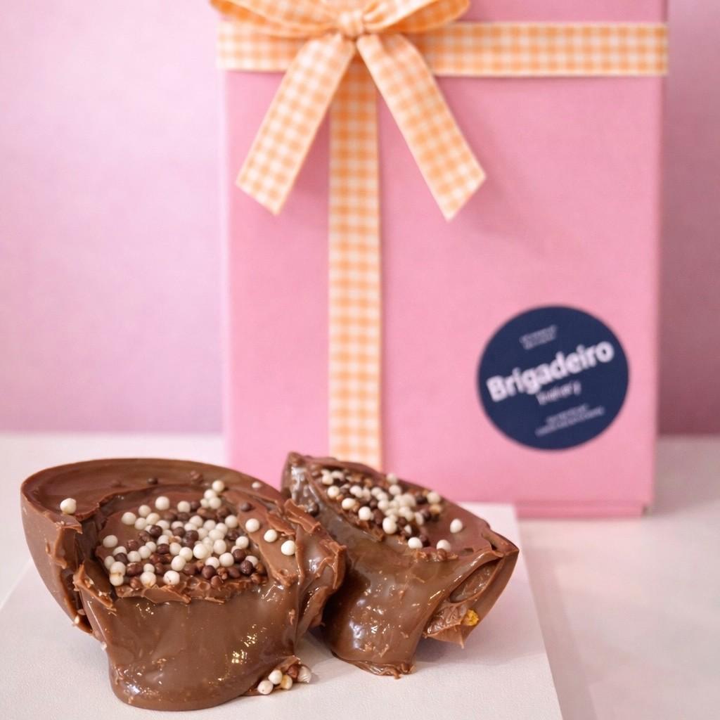 Brigadeiro Bakery: Creamy Chocolate Brigadeiro Easter Egg - Half Shell, 1 x $16.50
A smooth milk chocolate half shell filled with rich, creamy Brigadeiro—Brazil’s favorite chocolate treat. Made fresh in small batches, this spoonable egg is perfect for Easter gifting or enjoying straight from the shell.

A perfect little treat for family, friends, or yourself—because sometimes, the best treats come in small, spoonable packages!

Ingredients
38% milk chocolate, milk, sugar, butter, cocoa powder, 58% dark chocolate, corn starch and chocolate sprinkles.

Weight: approx. 0.37lbs / 170g - THIS EGG COMES AS A HALF SHELF

Shelf life
14 days refrigerated

Handmade.

Shelf life:
14 days refrigerated.

Important Delivery Info:
We want your treats to arrive fresh, safe, and right on time! To make that happen, please provide a contact name and phone number for the person who will be available during the delivery window. This helps our team coordinate and ensures your order gets to the right hands—no melted chocolate or missed deliveries here!