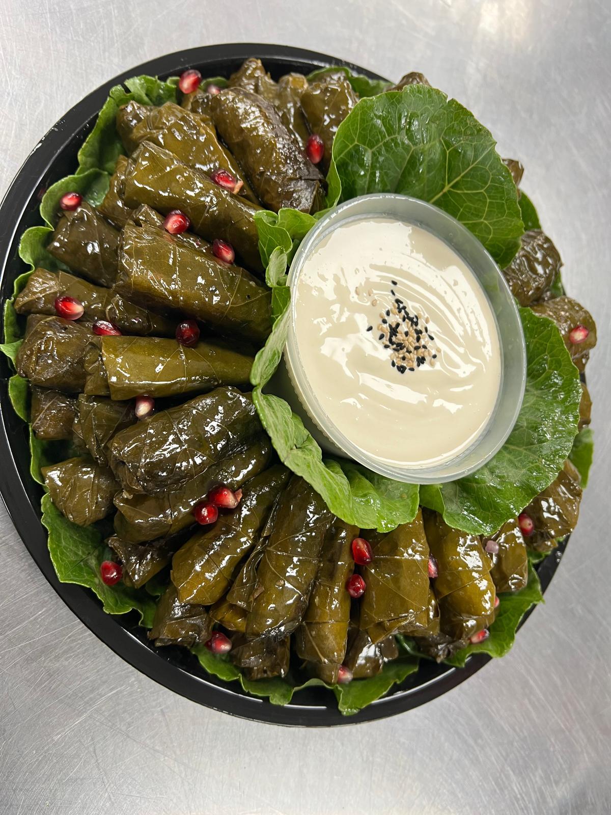 Casba Food And Pastries: Grape Leaves, 1 x $11.00
Grape leaves stuffed with brown rice, herbs, pomegranate, olive oil and seasonings. Served with a side of pita bread.