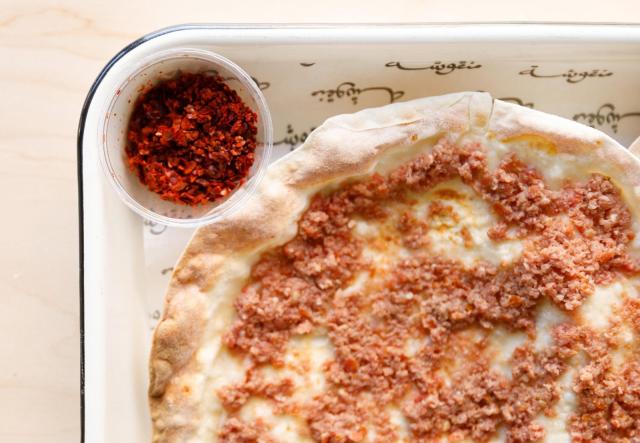 Manousheh: Lahem bi ajine, 1 x $7.00
ground beef, tomatoes, and onion baked on our crispy flatbread