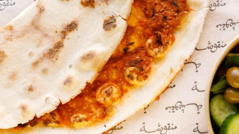 Manousheh: Kishek - TP , 1 x $10.00
Dried yogurt with tomato, onion, and sesame seeds baked on our flatbread