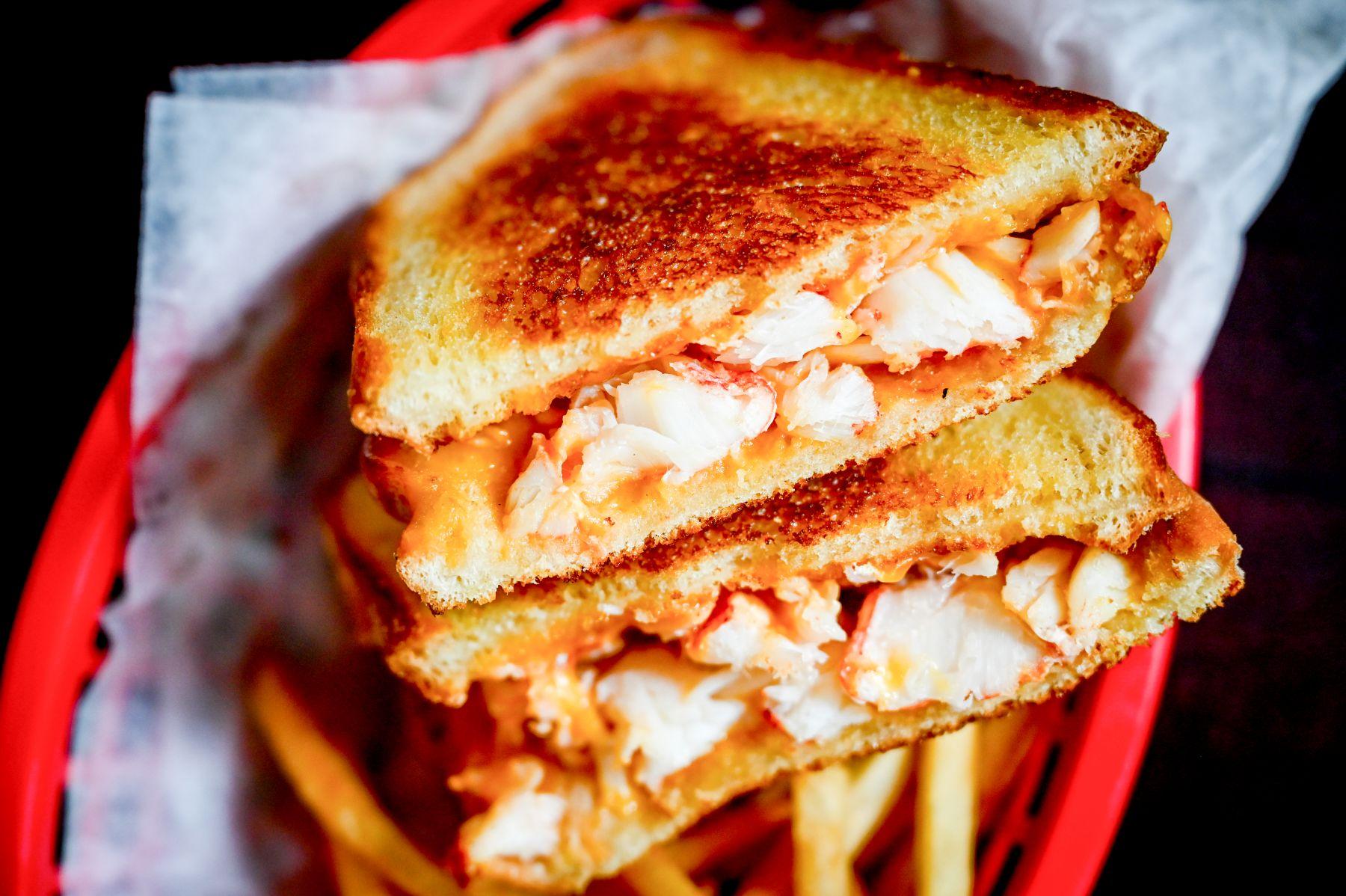 Lobstah On A Roll: Lobstah Grilled Cheese, 2 x $21.90
Indulge in the decadent flavor combination of mouth-watering lobster and cheesy indulgence with our Lobstah Grilled Cheese. It's made with melted cheddar cheese and succulent New England Lobstah meat sandwiched between sourdough bread — a true delight for your taste buds.