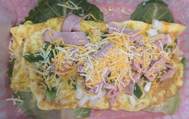 Lobstah On A Roll: Western Omelette, 1 x $15.95
A fluffy omelette filled with diced ham, sautéed bell peppers, and melted cheddar cheese, delivering a savory and satisfying breakfast classic.