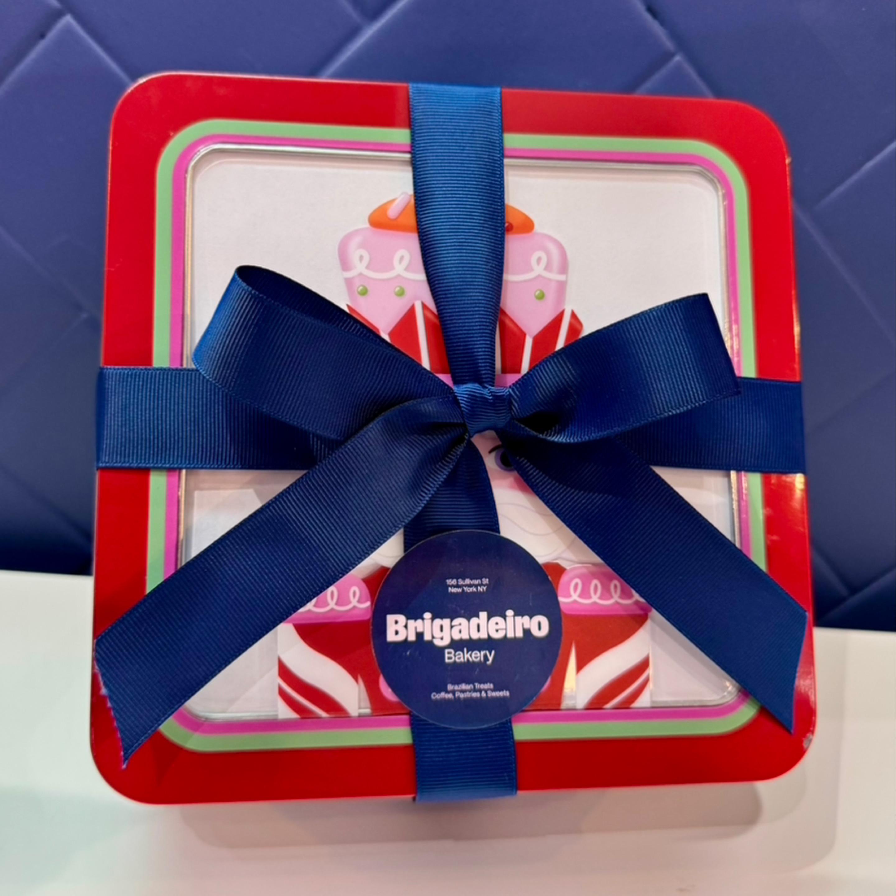 Brigadeiro Bakery: Coffee and Panettone Holiday Tin, 17 x $44.00
Our holiday tin features a 12oz bag of signature Brazilian Cafézinho coffee, accompanied by a mini chocolate panettone filled with chocolate chips and a creamy brigadeiro center.
Tin Size 7.5x7.5x3inches